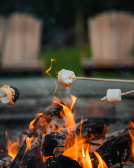 Toasting marshmallows over a fire pit at The Ritz Carlton Reynolds, Lake Oconee