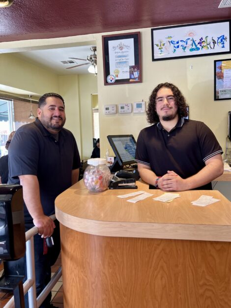 Jesse and Serio, the brothers who manage CJ's at the pay counter.