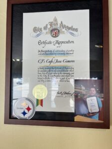 Certificate of Appreciation hanging in a window at CJ's Cafe