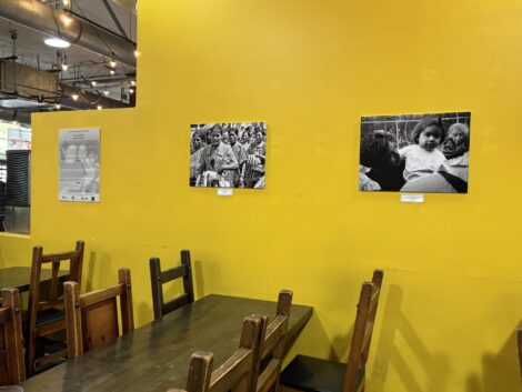 Art hangs on the wall at the Mercado La Paloma